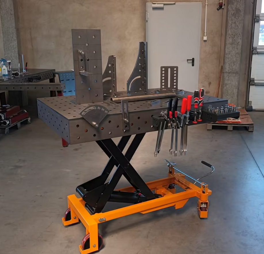 STAHLWERK SWITZERLAND Height-adjustable welding table 1200 x 800 mm hydraulic assembly table with 500 - 1100 mm lifting range, 750 kg load capacity, D16 perforated plate